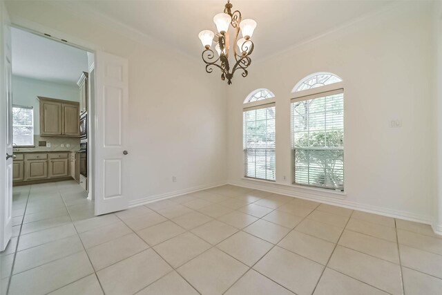 13331 Brentonwood Ln, Houston, TX 77077 - unfurnished room with ornamental molding, a chandelier, healthy amount of natural light, light tile patterned floors, and baseboards