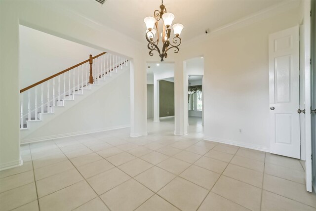 13331 Brentonwood Ln, Houston, TX 77077 - spare room with stairway, light tile patterned floors, a chandelier, baseboards, and crown molding