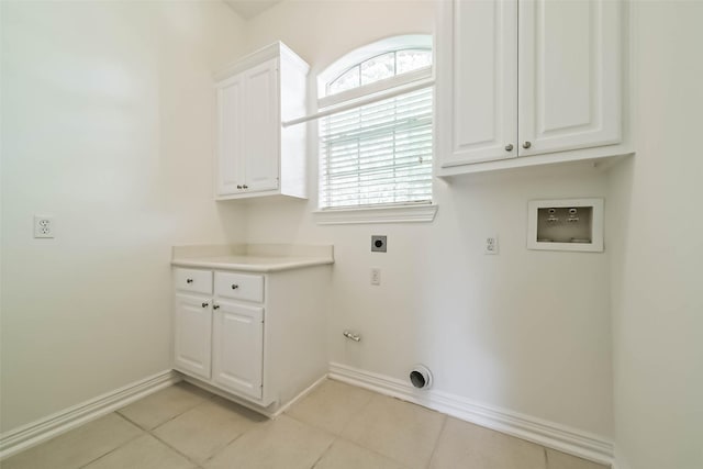 13331 Brentonwood Ln, Houston, TX 77077 - laundry room with hookup for an electric dryer, hookup for a washing machine, baseboards, and light tile patterned flooring