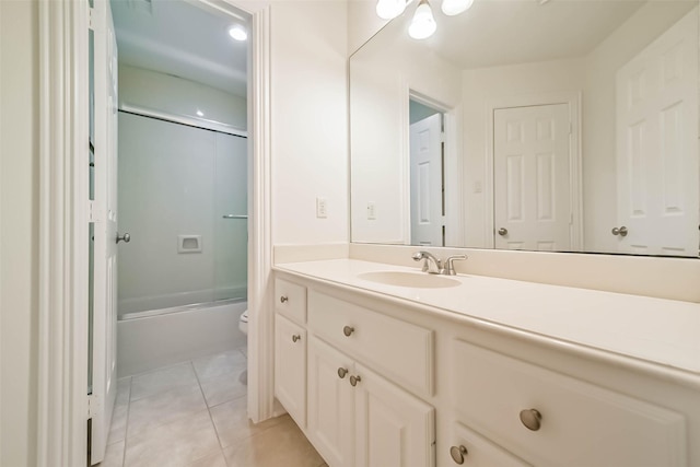 13331 Brentonwood Ln, Houston, TX 77077 - bathroom with toilet, vanity, tile patterned flooring, and bath / shower combo with glass door