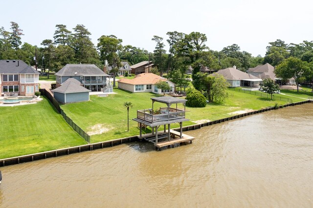 3623 Shore Shadows Dr, Crosby, TX 77532 - dock with a water view, a residential view, and a lawn