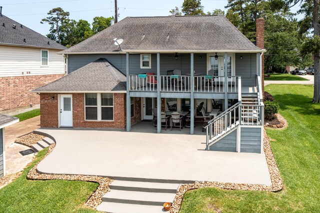 3623 Shore Shadows Dr, Crosby, TX 77532 - rear view of house with a patio area, a lawn, roof with shingles, ceiling fan, and stairway