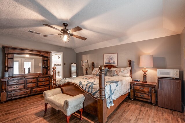 3623 Shore Shadows Dr, Crosby, TX 77532 - bedroom with wood finished floors, ceiling fan, and a textured ceiling