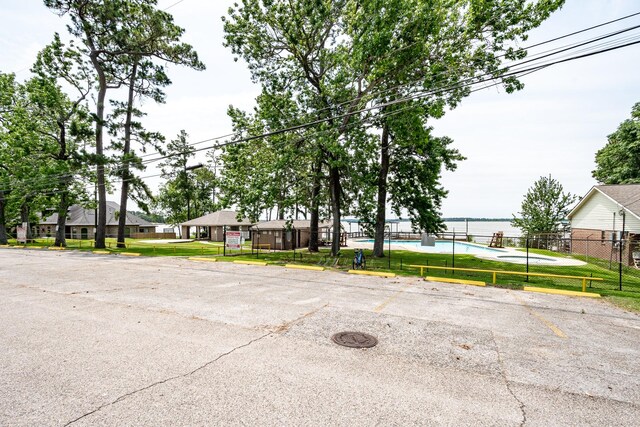 3623 Shore Shadows Dr, Crosby, TX 77532 - uncovered parking lot featuring a residential view
