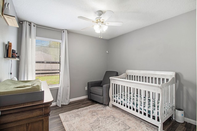 19198 County Road 669e, Alvin, TX 77511 - bedroom featuring multiple windows, wood finished floors, baseboards, and a ceiling fan