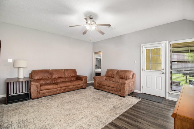 19198 County Road 669e, Alvin, TX 77511 - living area featuring dark wood-style flooring, ceiling fan, and baseboards
