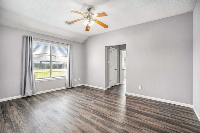 19198 County Road 669e, Alvin, TX 77511 - empty room featuring a ceiling fan, dark wood-style floors, baseboards, and a textured ceiling
