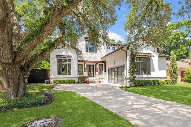 5202 Carew St, Houston, TX 77096 - modern farmhouse style home with stucco siding, stone siding, driveway, and a garage