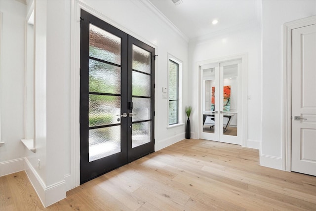 5202 Carew St, Houston, TX 77096 - entrance foyer with french doors, light wood finished floors, ornamental molding, and baseboards