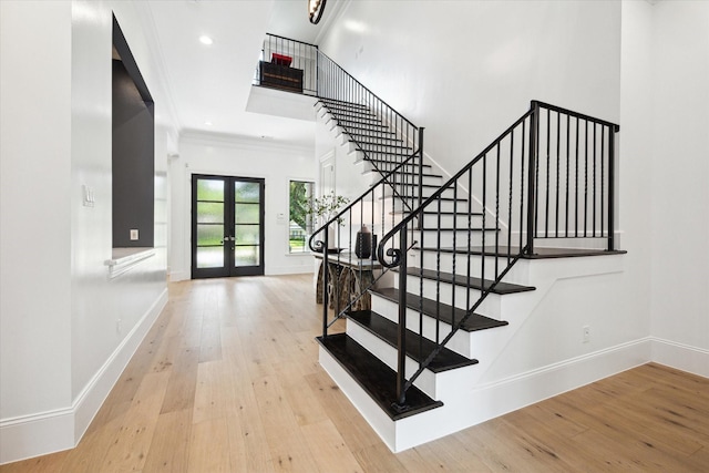 5202 Carew St, Houston, TX 77096 - entrance foyer featuring french doors, stairs, wood-type flooring, crown molding, and baseboards