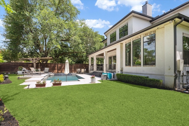 5202 Carew St, Houston, TX 77096 - back of house featuring a patio area, a chimney, and stucco siding