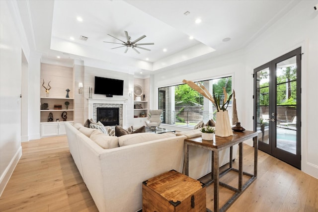 5202 Carew St, Houston, TX 77096 - living area with a raised ceiling, light wood finished floors, plenty of natural light, and recessed lighting