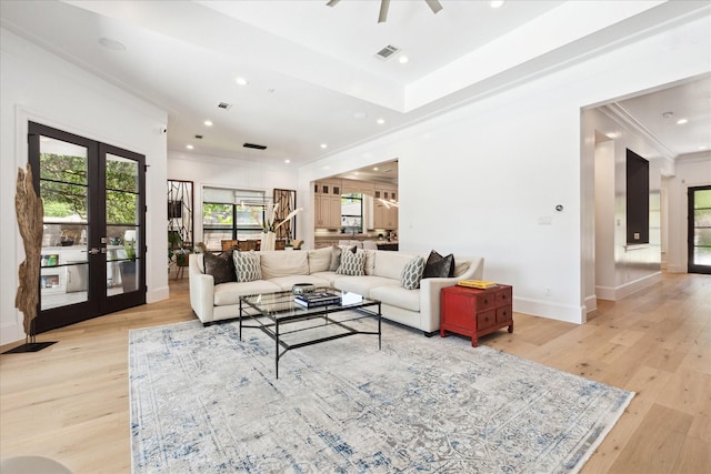 5202 Carew St, Houston, TX 77096 - living area featuring light wood-style floors, baseboards, ornamental molding, recessed lighting, and french doors