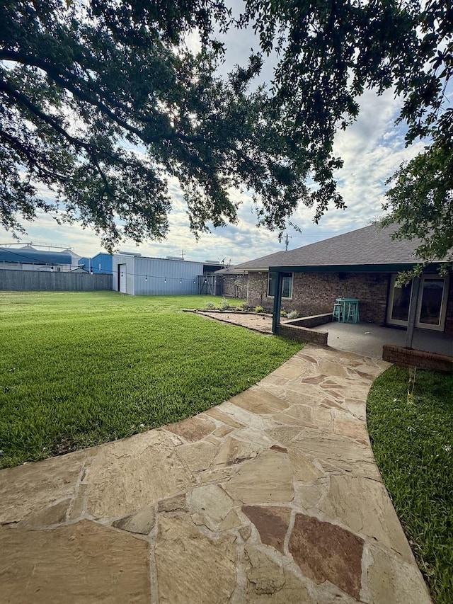 563 12th St, Bay City, TX 77414 - view of yard with a patio area