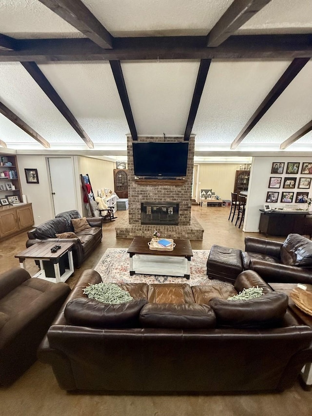 563 12th St, Bay City, TX 77414 - living room featuring a brick fireplace and beam ceiling