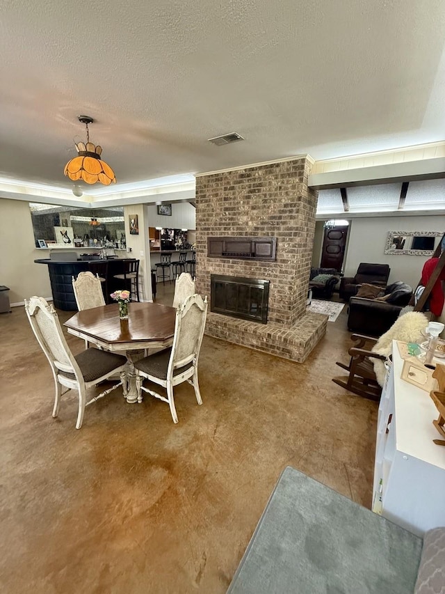 563 12th St, Bay City, TX 77414 - dining room with a brick fireplace and a textured ceiling