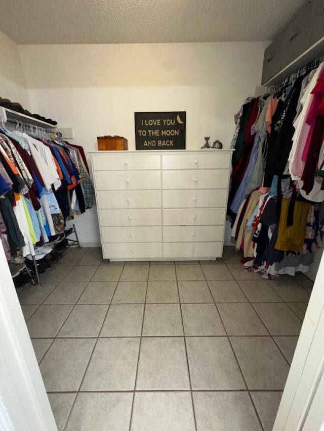 563 12th St, Bay City, TX 77414 - walk in closet with light tile patterned floors