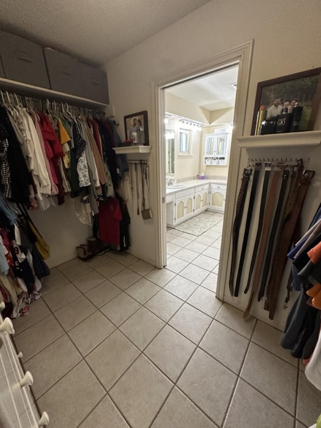 563 12th St, Bay City, TX 77414 - spacious closet featuring light tile patterned floors and a sink
