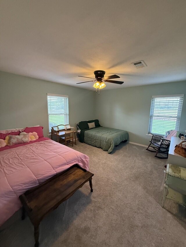 563 12th St, Bay City, TX 77414 - bedroom with carpet floors, a ceiling fan, and baseboards