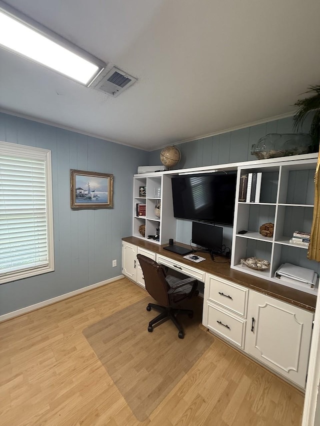 563 12th St, Bay City, TX 77414 - office with built in desk, light wood-style flooring, and baseboards