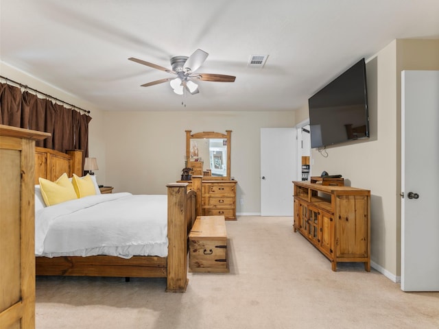 563 12th St, Bay City, TX 77414 - bedroom with light carpet and a ceiling fan