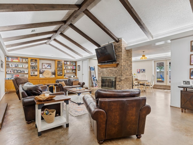 563 12th St, Bay City, TX 77414 - living area with finished concrete floors, a brick fireplace, a textured ceiling, and built in shelves