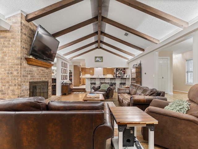 563 12th St, Bay City, TX 77414 - living room featuring a textured ceiling and a fireplace