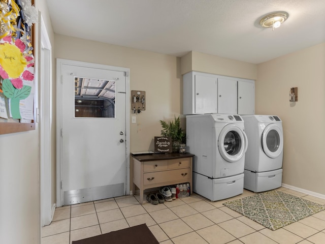 563 12th St, Bay City, TX 77414 - laundry area featuring washer and dryer, light tile patterned floors, and healthy amount of natural light