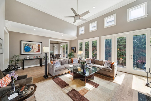 40 E Broad Oaks Dr, Houston, TX 77056 - living area with french doors, ornamental molding, light wood-type flooring, a high ceiling, and recessed lighting