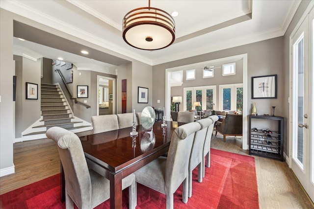 40 E Broad Oaks Dr, Houston, TX 77056 - dining room featuring healthy amount of natural light, wood finished floors, stairs, crown molding, and ceiling fan