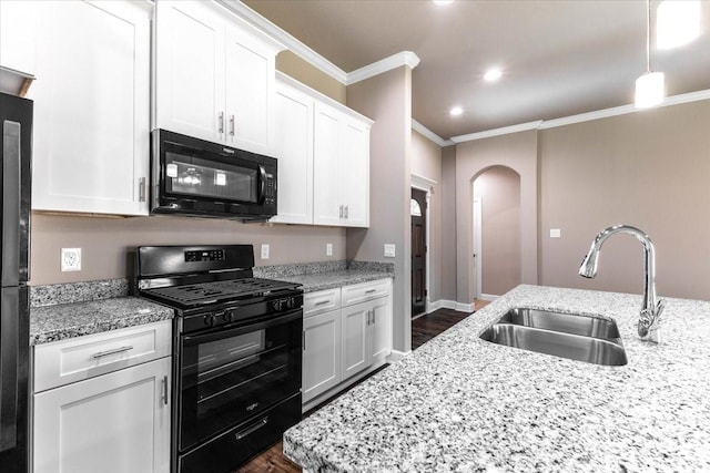 6514 Arabella, Houston, TX 77091 - kitchen with black appliances, a sink, ornamental molding, arched walkways, and dark wood finished floors