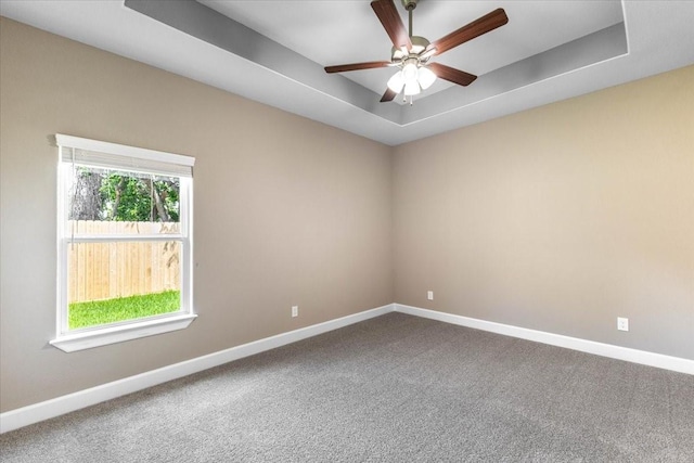 6514 Arabella, Houston, TX 77091 - carpeted spare room featuring baseboards, a raised ceiling, and ceiling fan