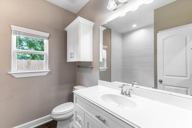 6514 Arabella, Houston, TX 77091 - bathroom with vanity, toilet, baseboards, and wood finished floors