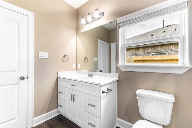6514 Arabella, Houston, TX 77091 - half bath with vanity, toilet, baseboards, and wood finished floors