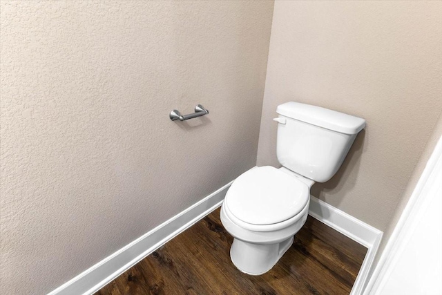 6514 Arabella, Houston, TX 77091 - bathroom with baseboards, wood finished floors, and toilet