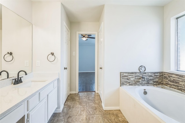 12023 Thornburg Ln, Houston, TX 77067 - full bath featuring baseboards, vanity, a garden tub, and a ceiling fan