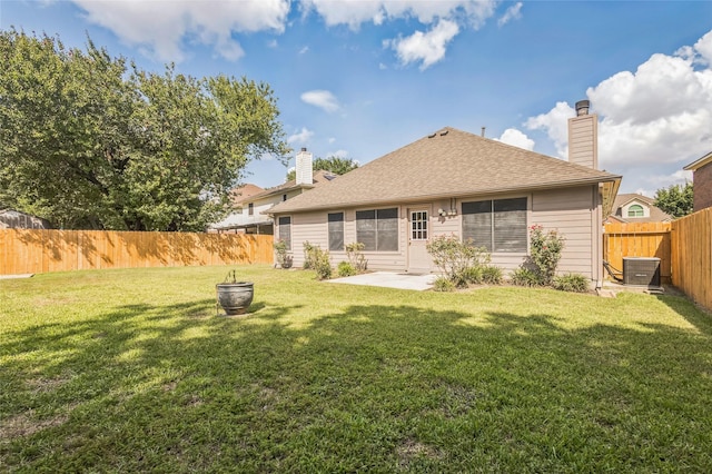 12023 Thornburg Ln, Houston, TX 77067 - rear view of property featuring cooling unit, a patio, a chimney, and a shingled roof