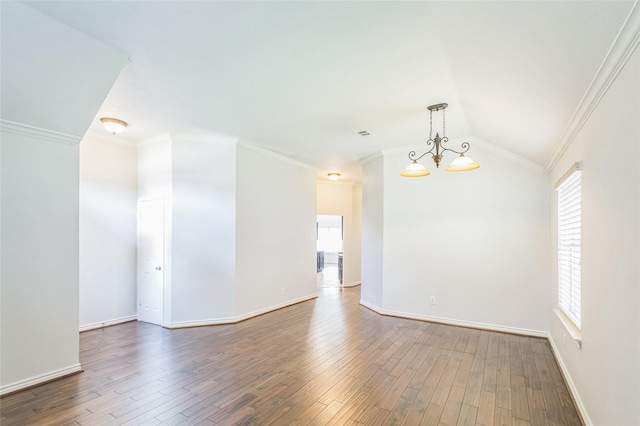 12023 Thornburg Ln, Houston, TX 77067 - unfurnished room with wood finished floors, crown molding, baseboards, lofted ceiling, and a chandelier