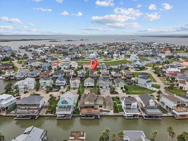 502 Westerly Dr, Tiki Island, TX 77554 - aerial view of residential area featuring a nearby body of water
