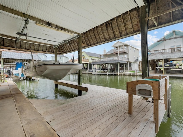 502 Westerly Dr, Tiki Island, TX 77554 - dock featuring boat lift and a water view