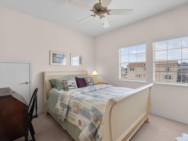 502 Westerly Dr, Tiki Island, TX 77554 - bedroom with carpet flooring, baseboards, and ceiling fan