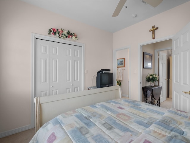 502 Westerly Dr, Tiki Island, TX 77554 - bedroom featuring carpet, baseboards, a closet, and a ceiling fan