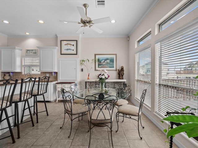 502 Westerly Dr, Tiki Island, TX 77554 - dining space with ornamental molding, light tile patterned flooring, ceiling fan, recessed lighting, and breakfast area