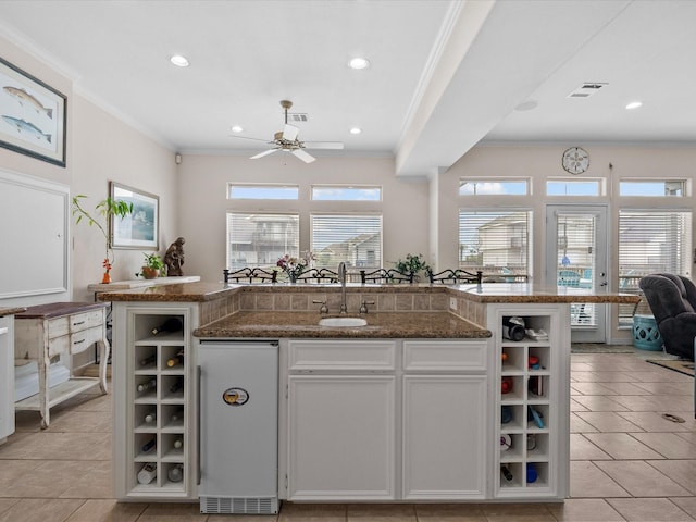 502 Westerly Dr, Tiki Island, TX 77554 - kitchen featuring a sink, crown molding, ceiling fan, refrigerator, and open shelves
