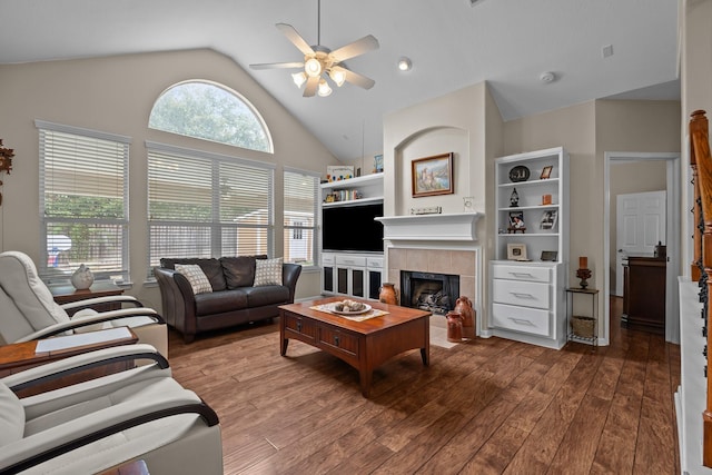 2615 Crystal Falls Dr, Pearland, TX 77584 - living room with ceiling fan, wood finished floors, a fireplace, and high vaulted ceiling