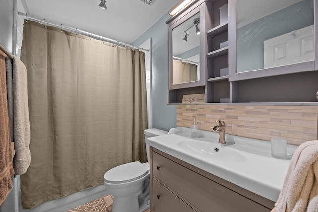 2615 Crystal Falls Dr, Pearland, TX 77584 - bathroom featuring toilet, vanity, and tasteful backsplash