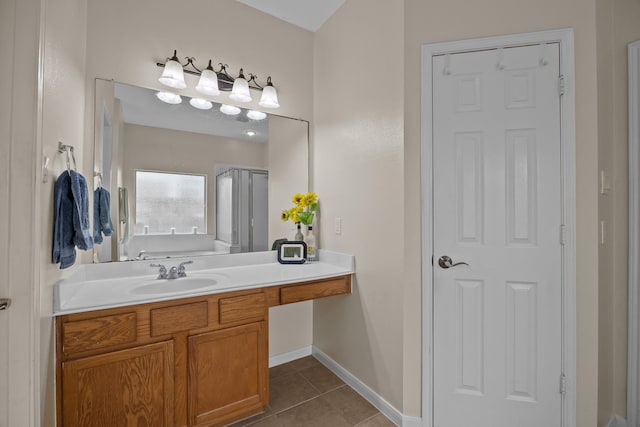 2615 Crystal Falls Dr, Pearland, TX 77584 - full bathroom with tile patterned floors, vanity, and baseboards