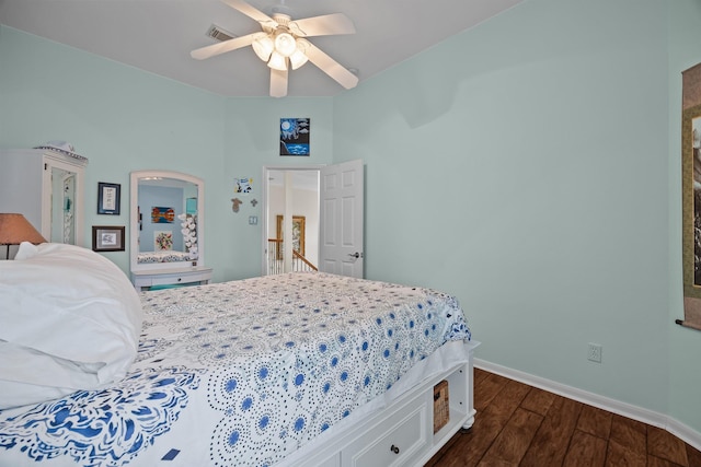 2615 Crystal Falls Dr, Pearland, TX 77584 - bedroom with dark wood finished floors, baseboards, and a ceiling fan