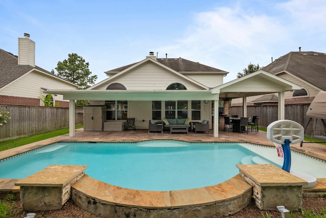 2615 Crystal Falls Dr, Pearland, TX 77584 - view of swimming pool featuring an outdoor hangout area, a fenced backyard, and a patio area