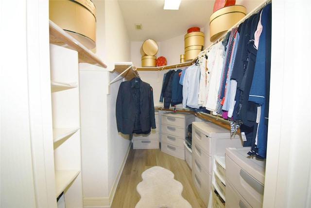 5810 Brook Bend Dr, Sugar Land, TX 77479 - walk in closet featuring light wood finished floors
